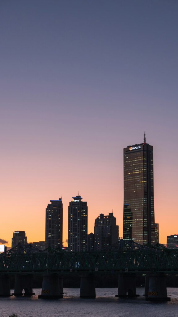 City skyline with bridge at sunset